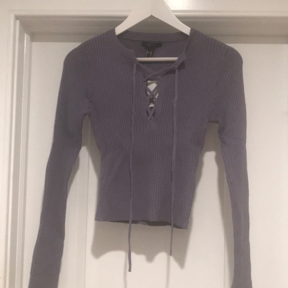 Knit long sleeve top.  Original tags.  Never worn.  Dusty blue